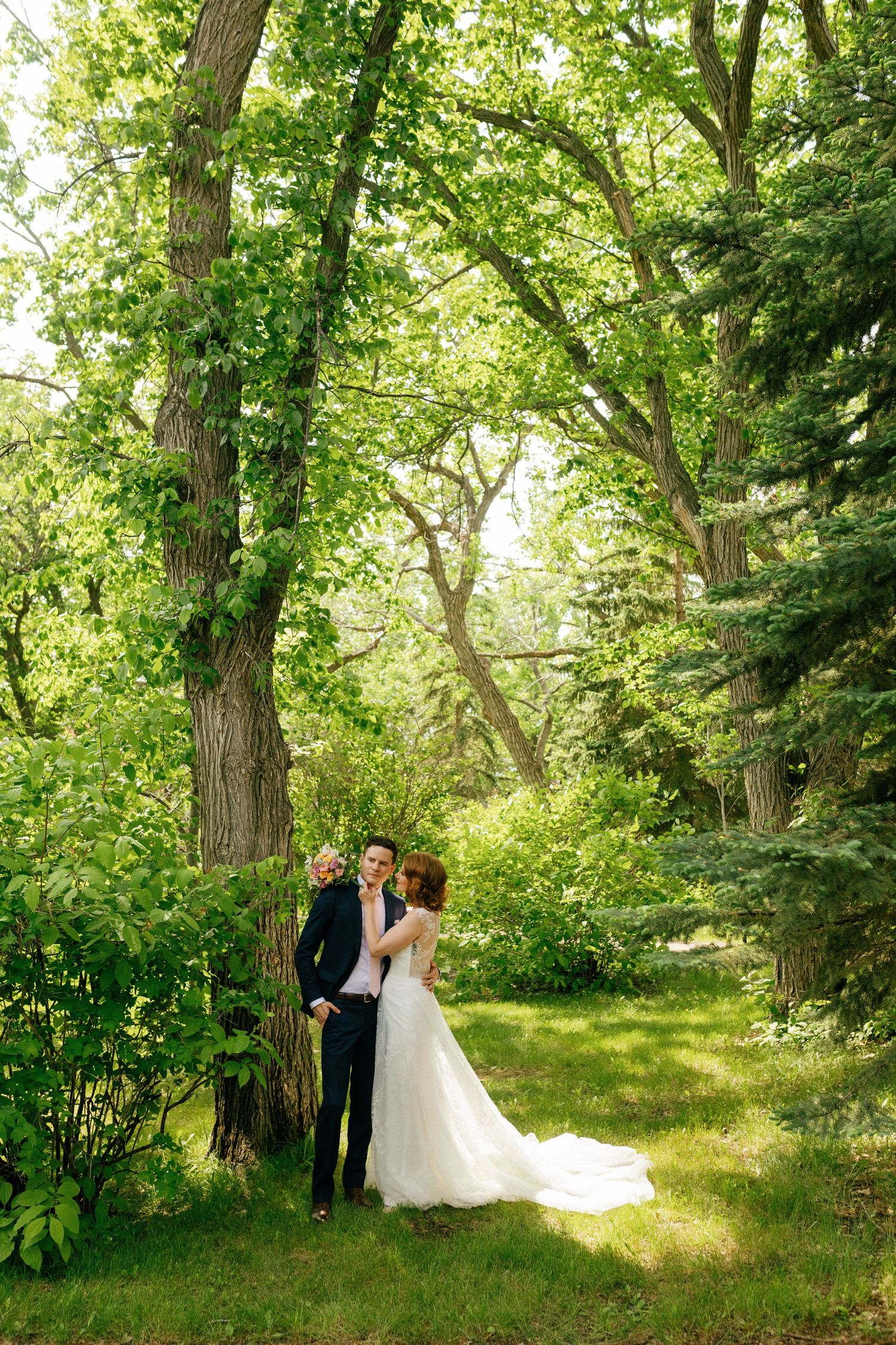gorgeous greenery with wedding couple nestled in the photo