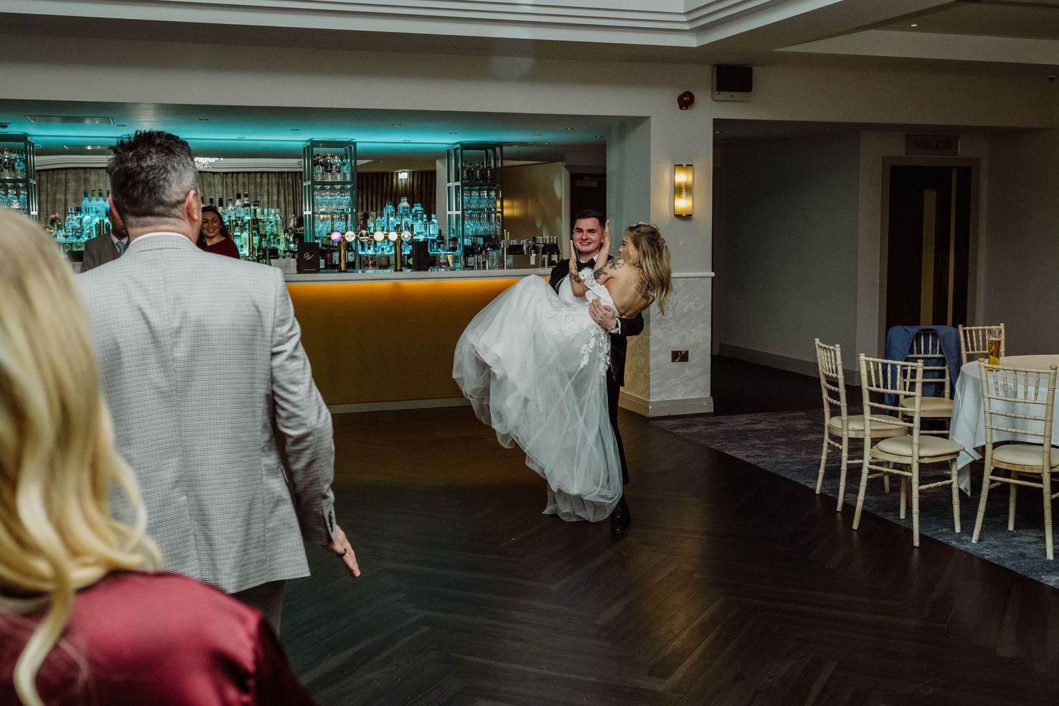 Bride and groom surrounded by guests