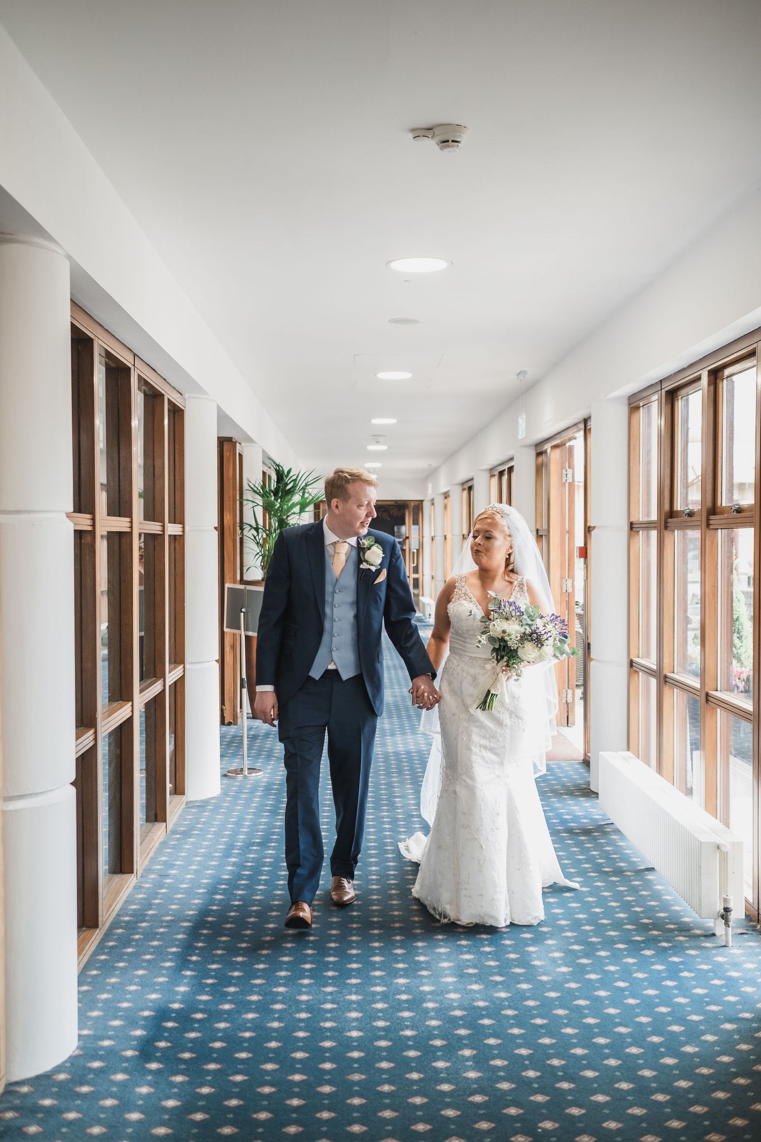 Bride and Groom walking Weetwood Hall Leeds