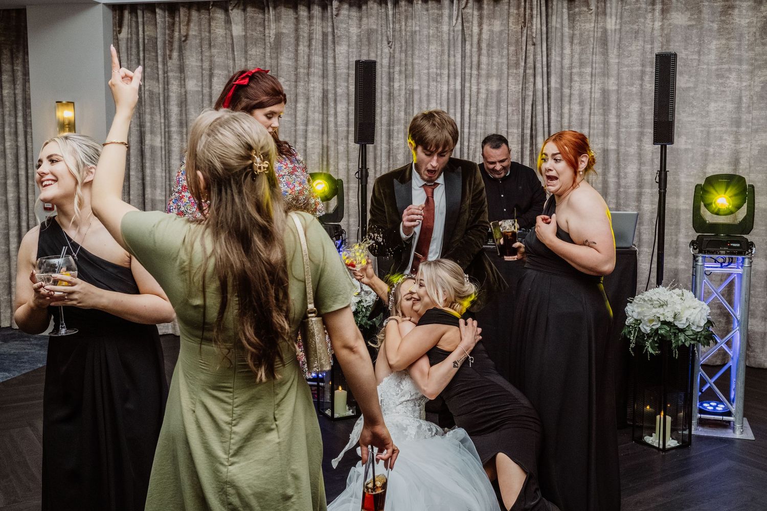 Bride and groom surrounded by guests