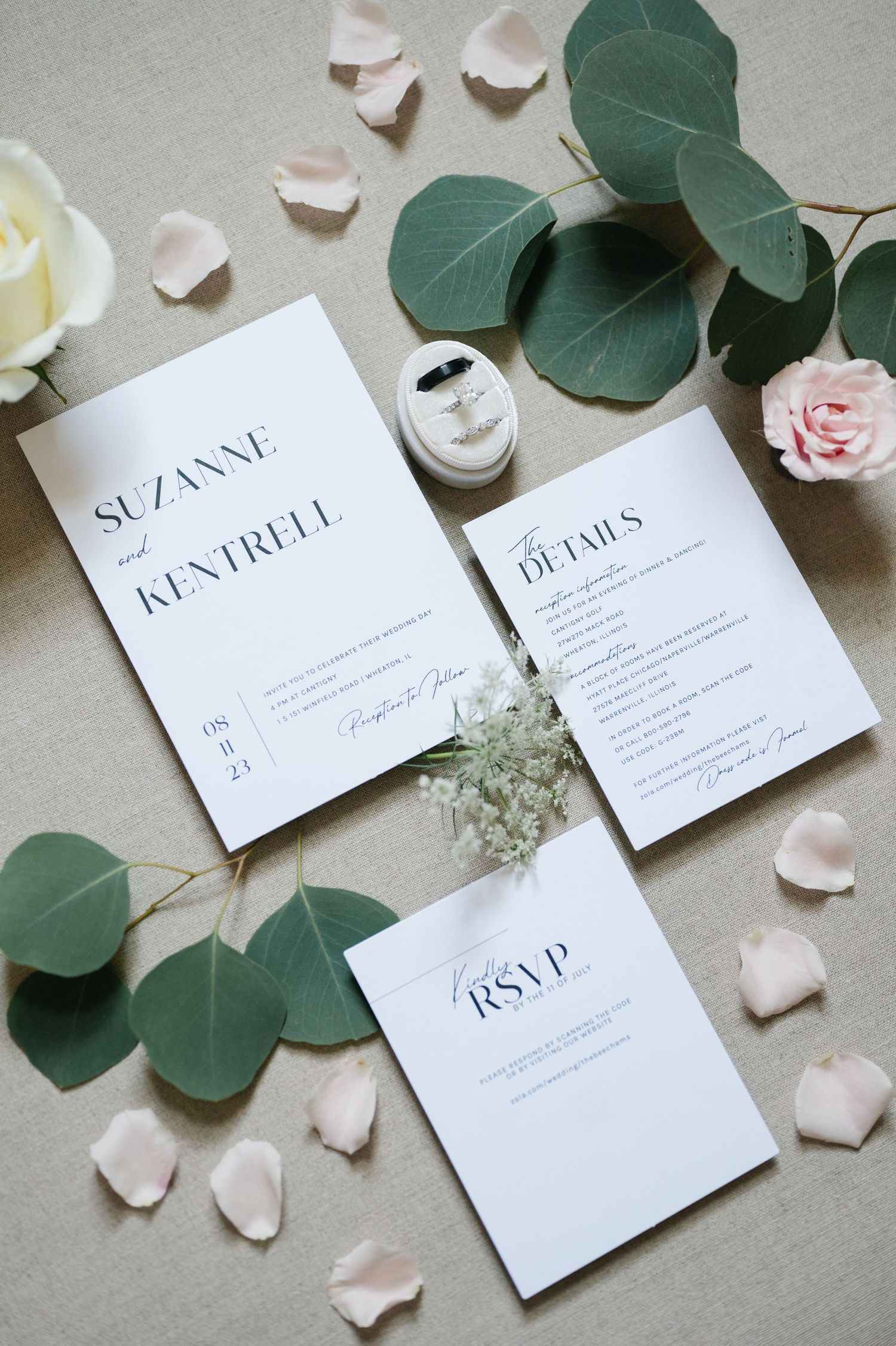 Elegant minimalist wedding invitation suite with delicate rose petals and eucalyptus leaves on beige background.