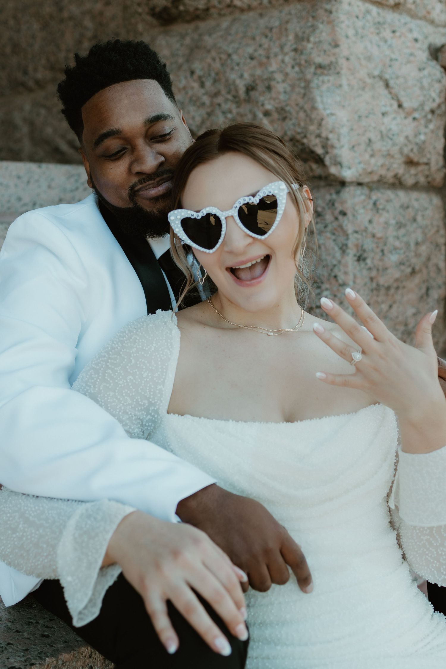 A romantic wedding photoshoot sequence showing the couple sharing joyful laughter and intimate moments together.