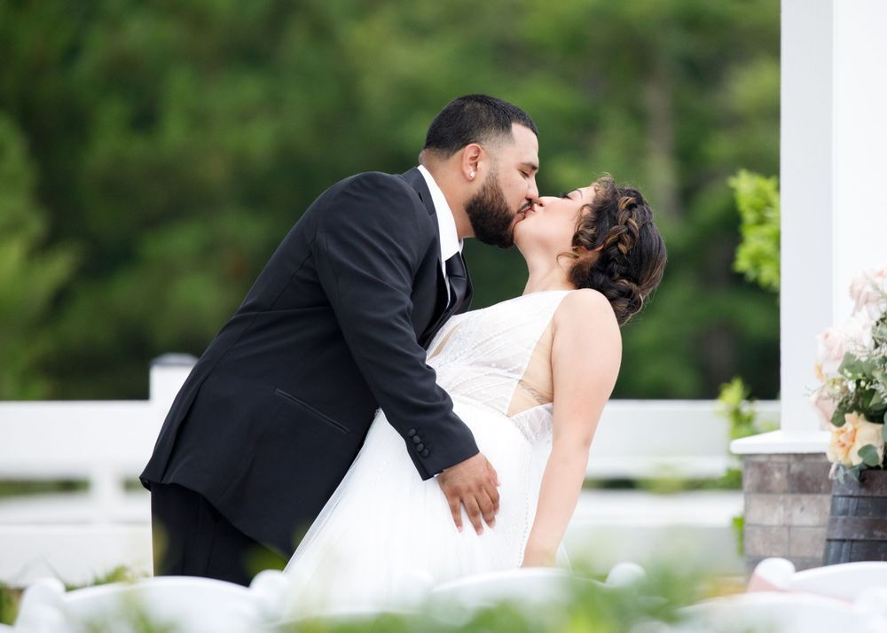 Four romantic wedding photos show couples embracing and kissing outdoors against a natural backdrop.