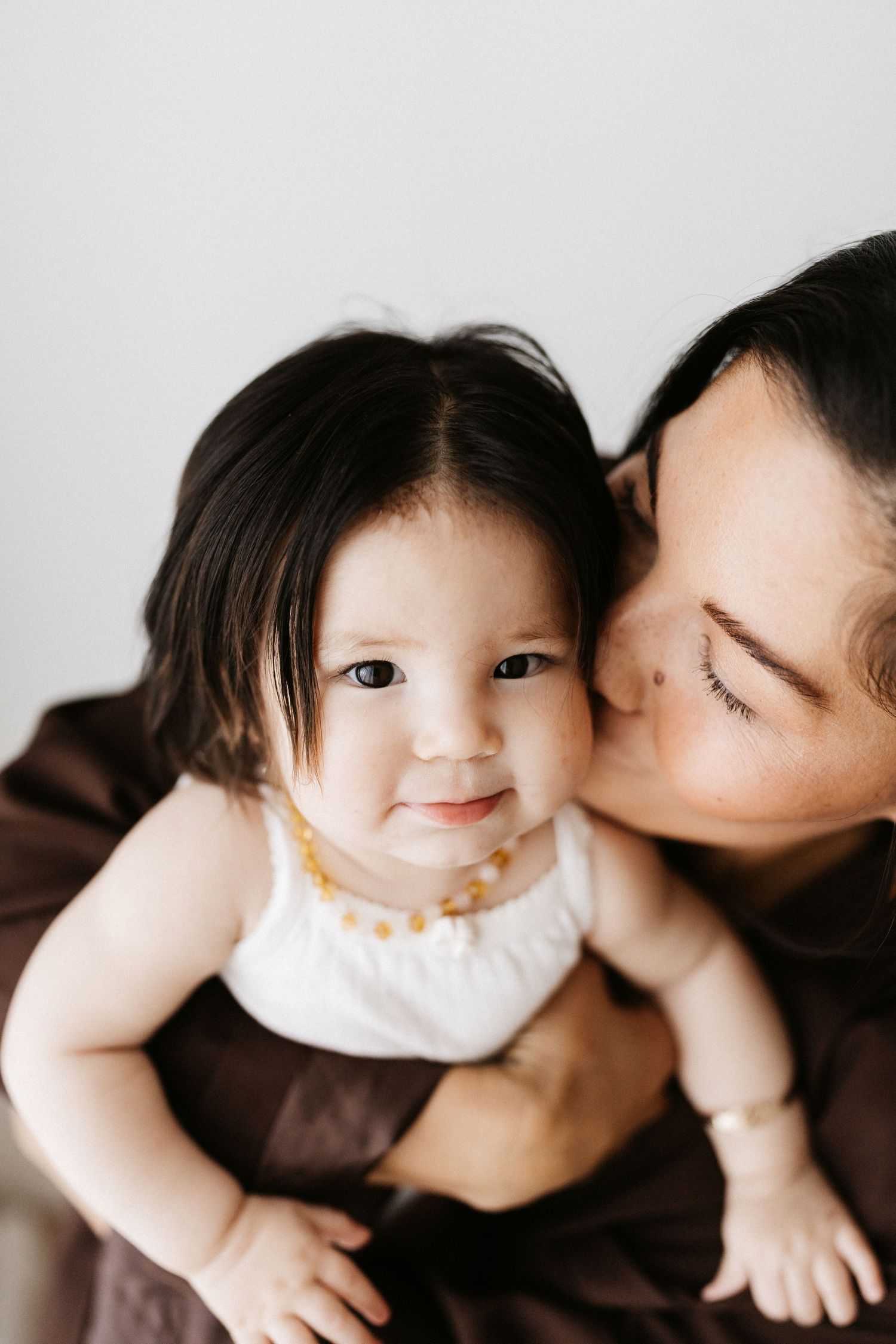 Intimate black and white series of parent and baby sharing tender moments.