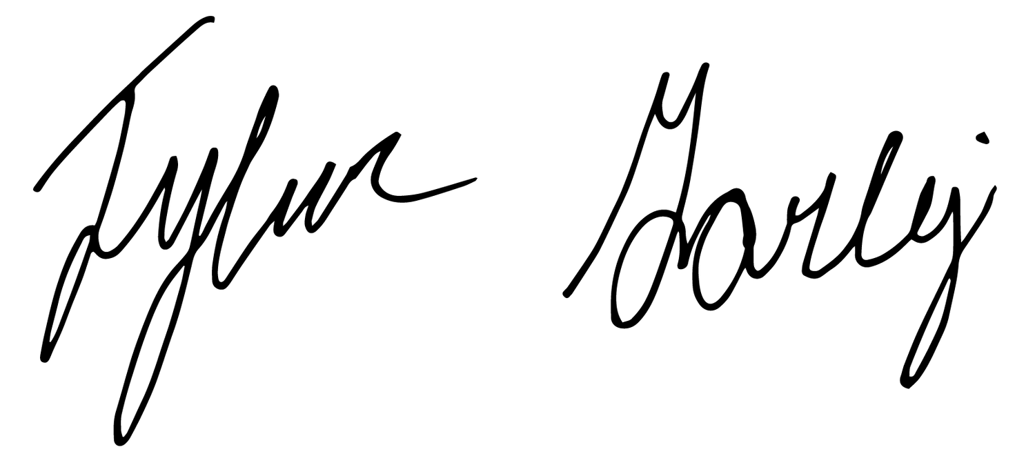 Handwritten signature in black ink on white background.
