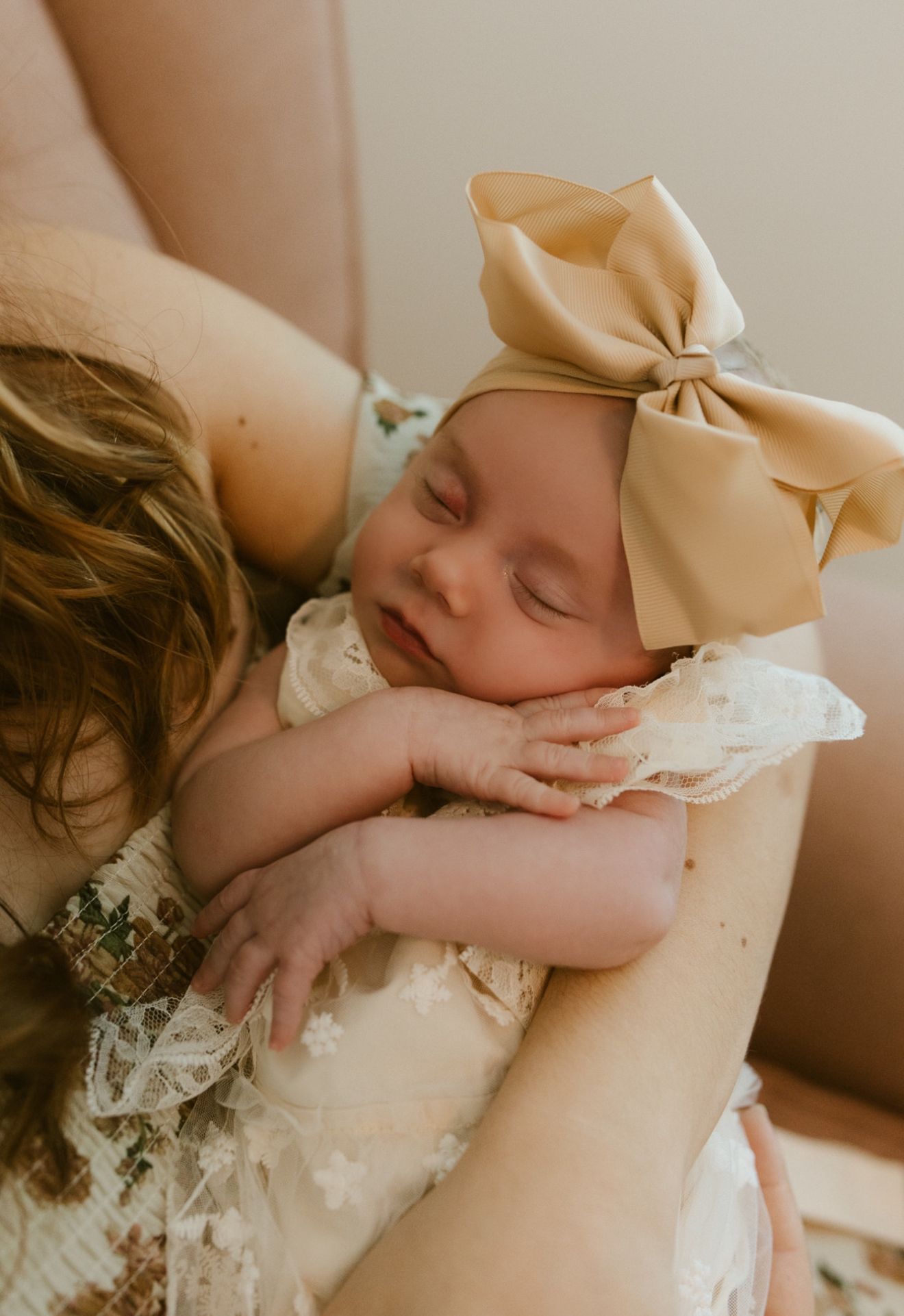 A portrait of a newborn in her mom’s arms