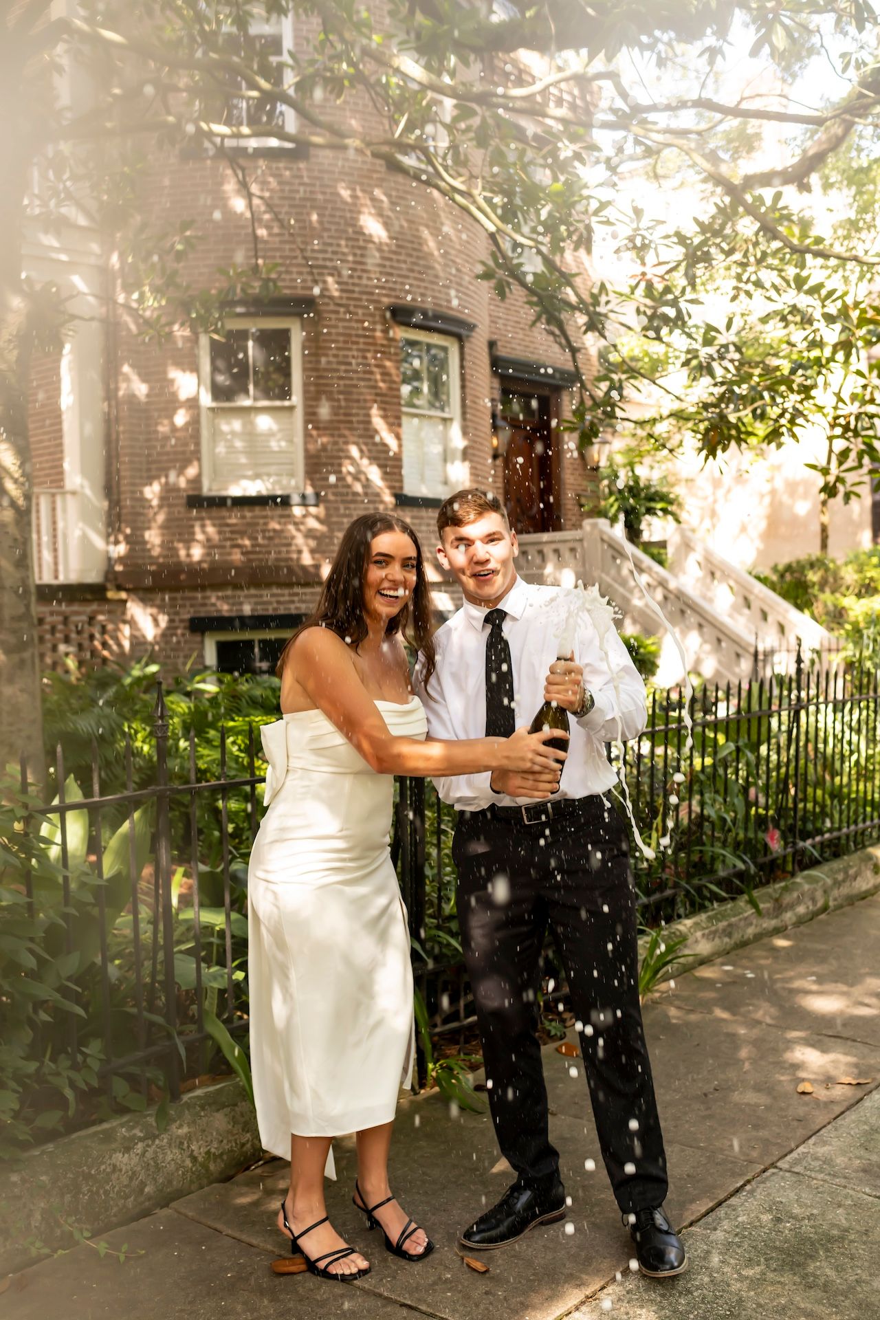Sequence of romantic moments captured on a sunny porch as confetti falls around a wedding couple.