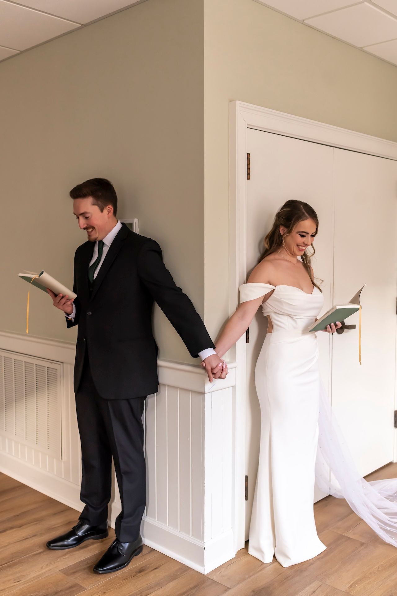 Emotional first look moment between couple on wedding day, captured in sequence showing reactions through doorway.