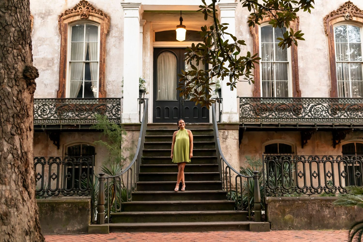 A series of connected images showing people walking up and down ornate stone steps with vintage iron railings in a historic area.