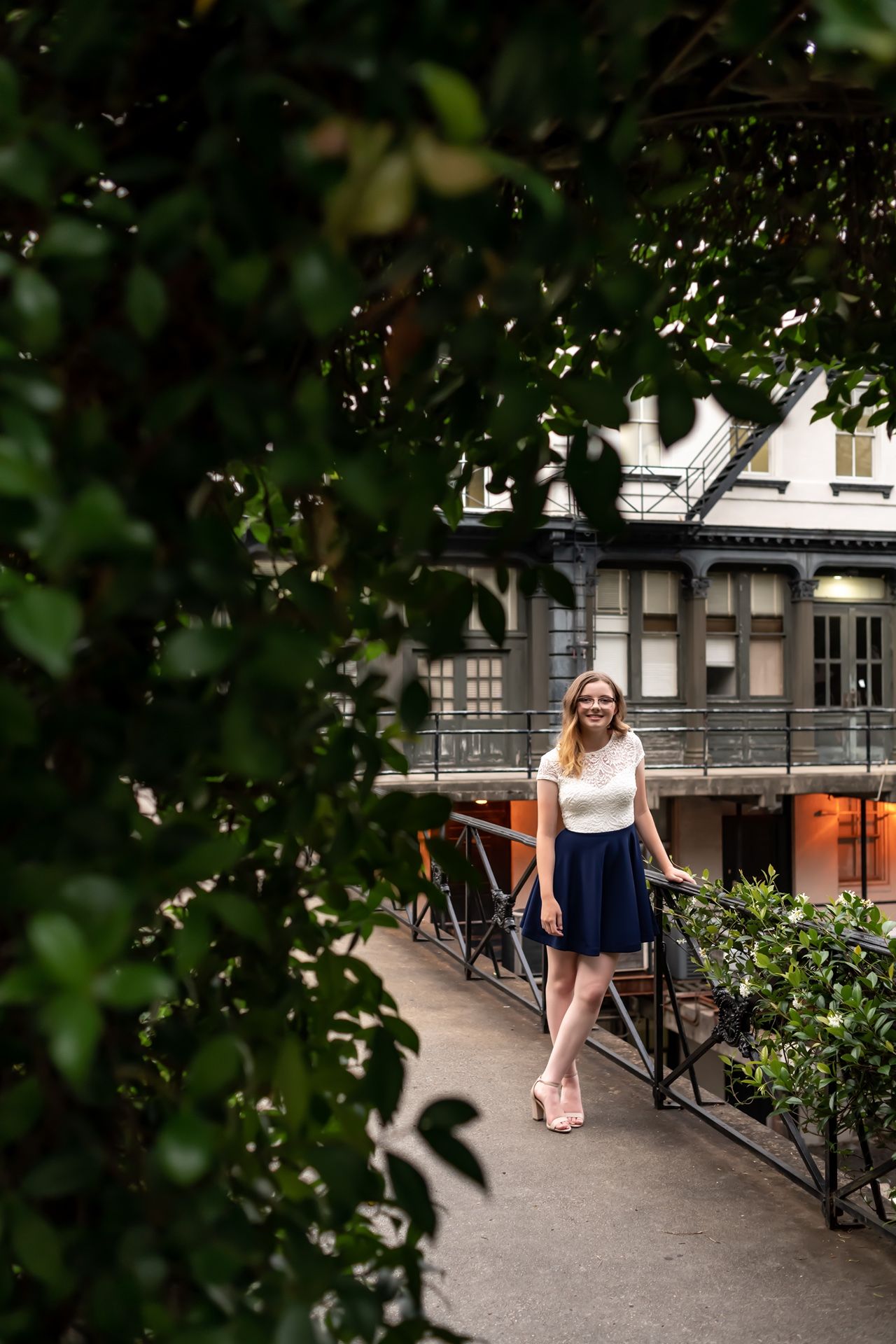 A series of connected photos showing glimpses of a person sitting on benches along a garden path framed by green foliage.