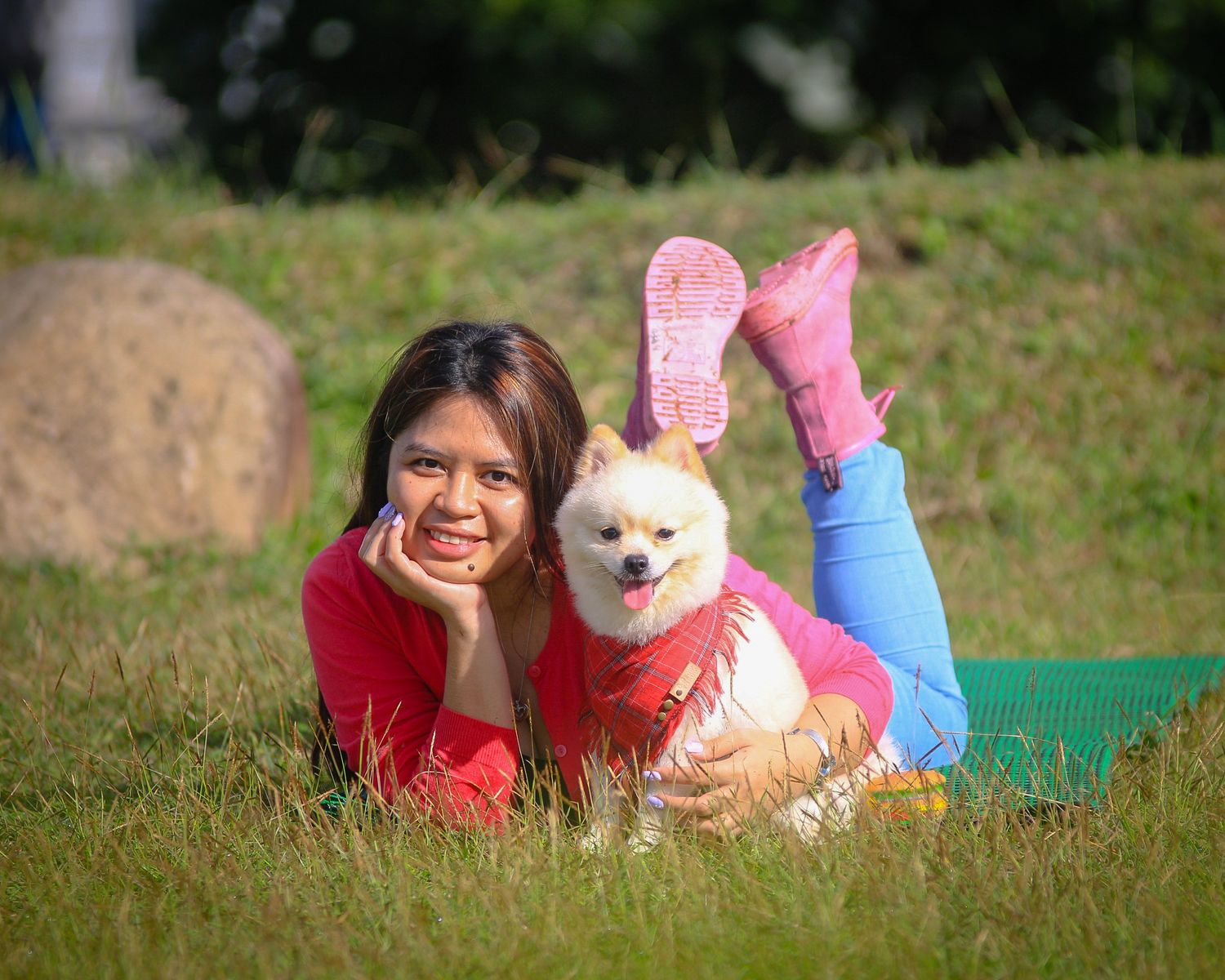outdoor portrait of a lady with her Pomeranian dog