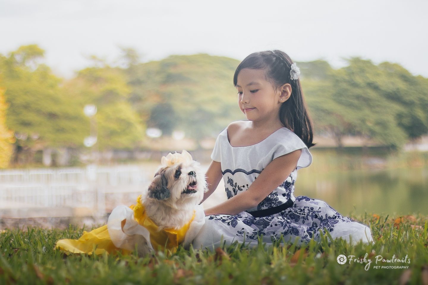 little girl and her dog enjoying at the park