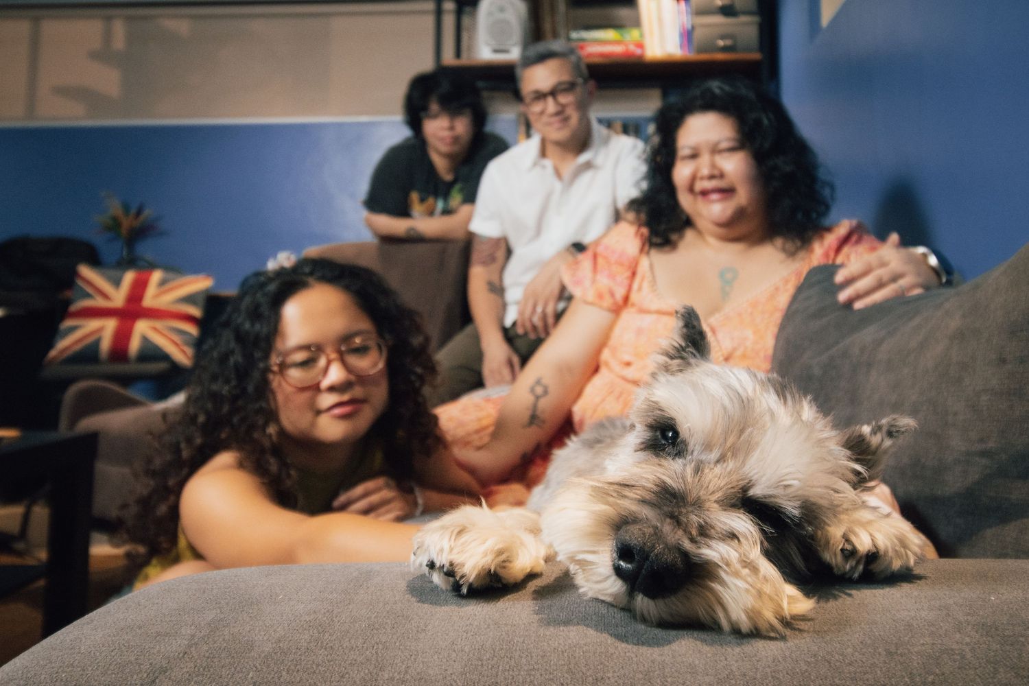 indoor portrait of a family with their senior dog