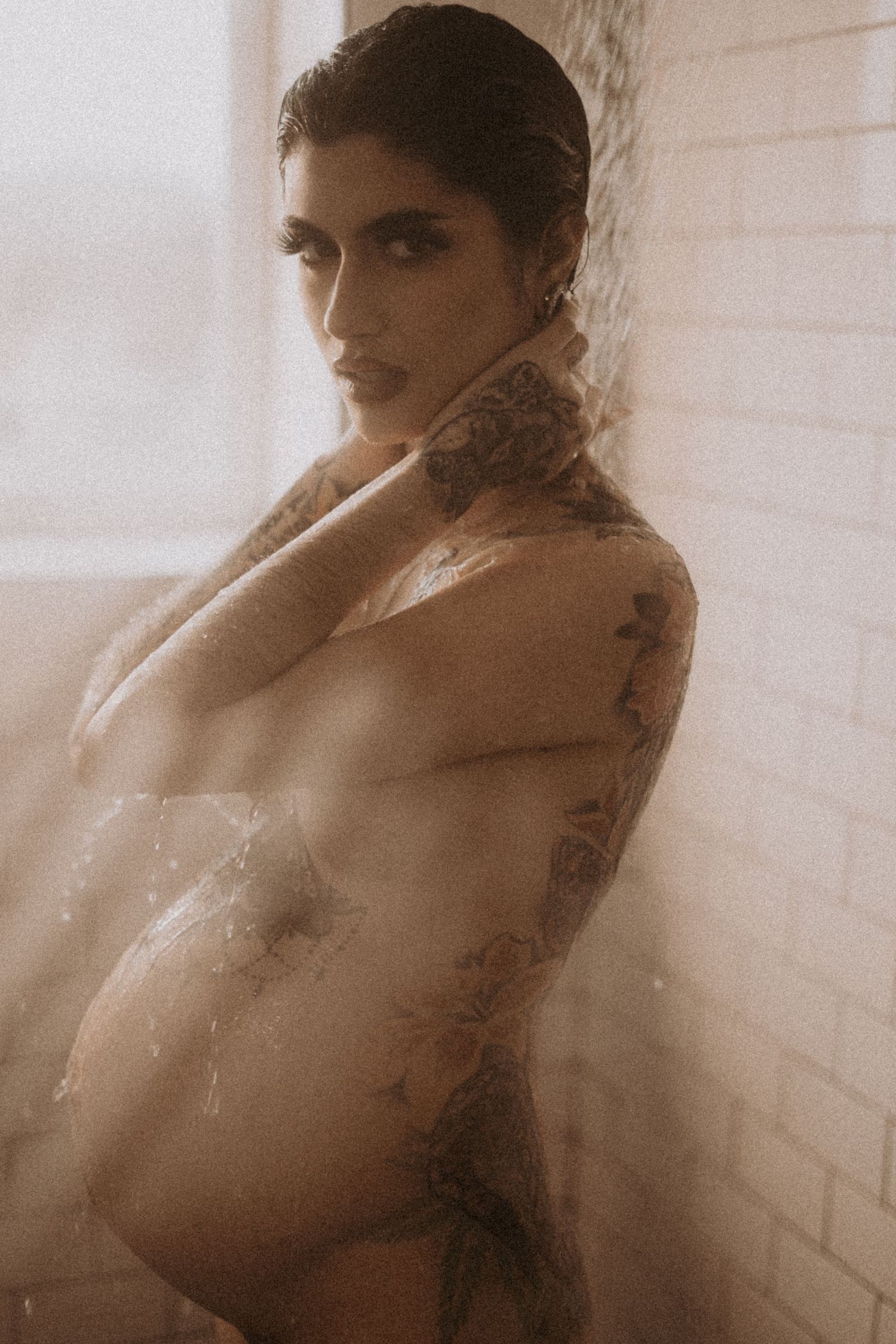 Artistic black and white boudoir photo series with soft lighting and shadows.
