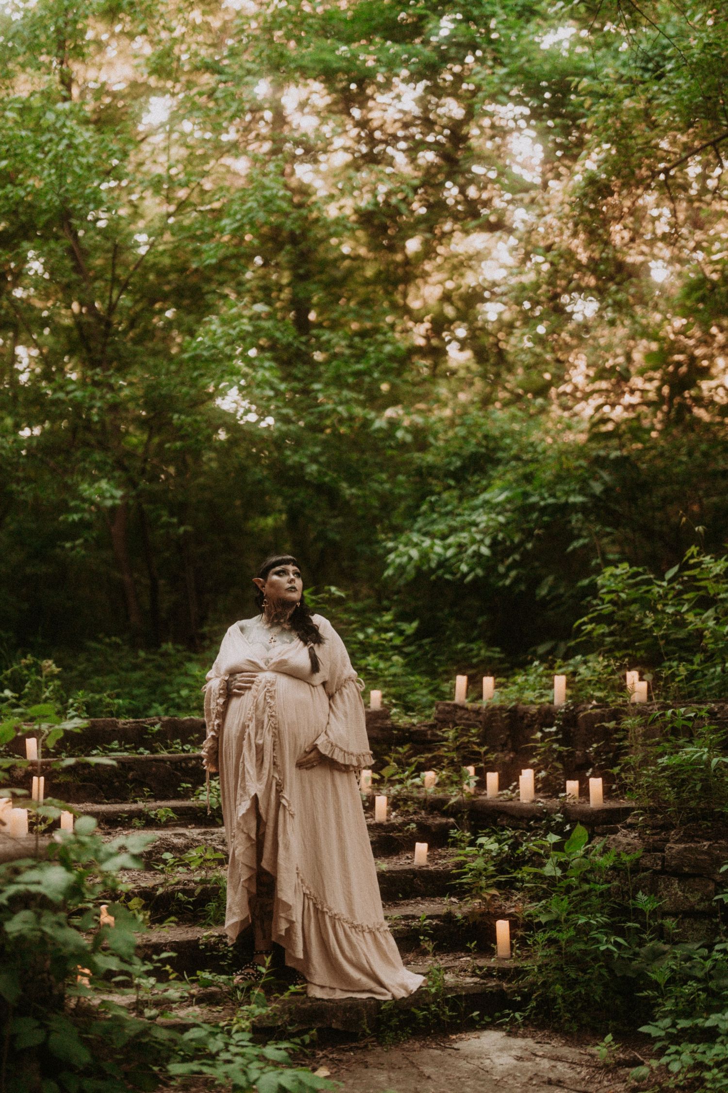 A series of atmospheric forest photos with candles and ethereal lighting creating a mystical outdoor scene at dusk.