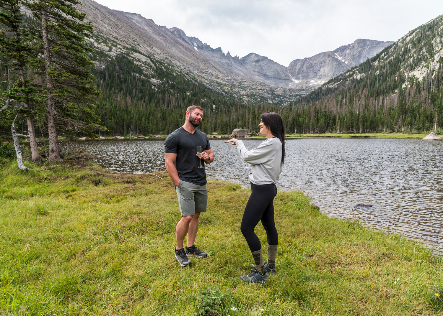 Couple enjoying the amazing views around Jewel Lake in Rocky Mountain National Park after his surprise marriage proposal.