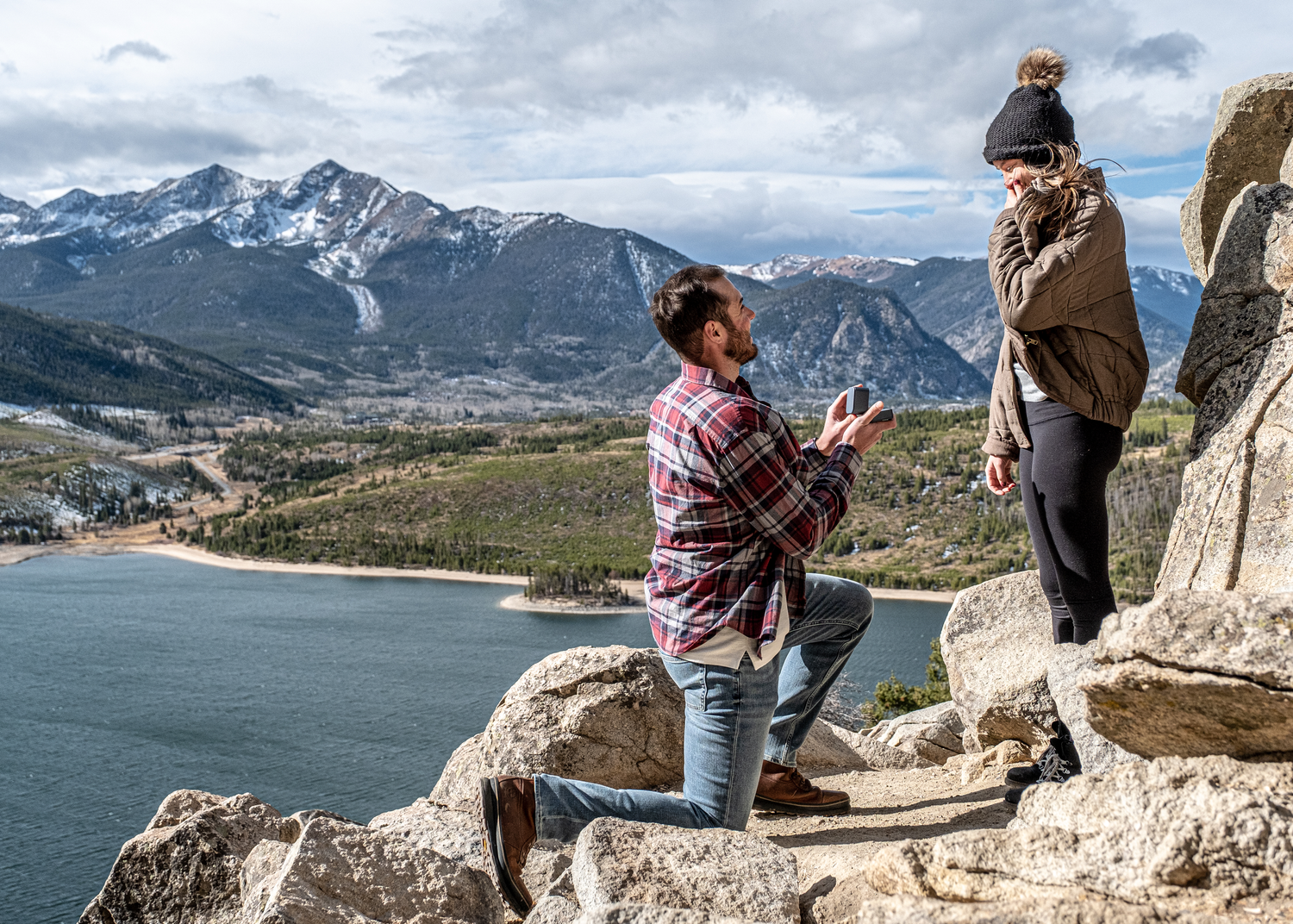 A series of proposal photos showing a couple on Sapphire Point Overlook near Breckenridge with a scenic lake and mountain backdrop.