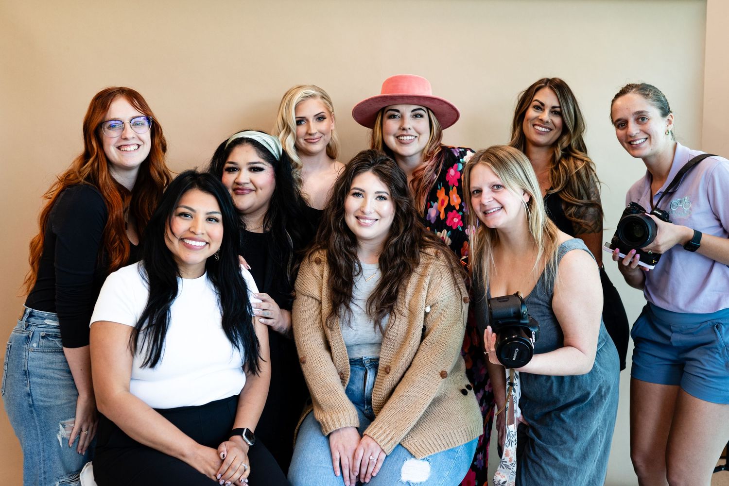 A group photo of women posing together, showcasing diverse styles and fashion.