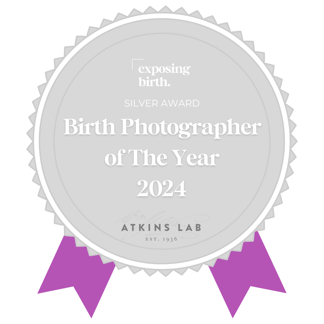 Silver award badge with purple ribbons for Birth Photographer of The Year 2024 from Atkins Lab.