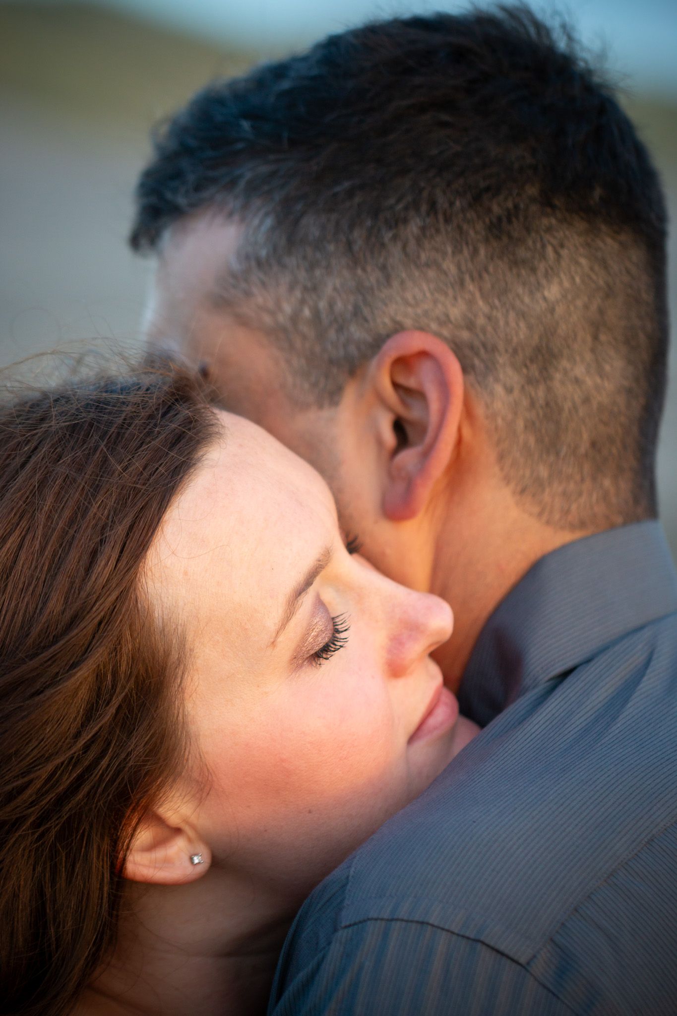 A tender romantic moment shared between a couple during an intimate embrace.