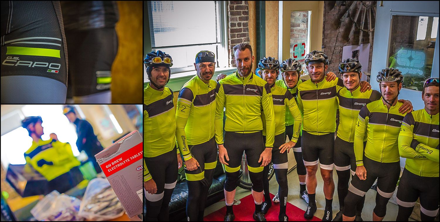 Cycling team members in bright yellow uniforms posing together for group photo.