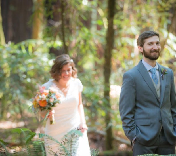 Wedding couple poses separately in a lush forest setting with vibrant greenery and a beautiful bridal bouquet.