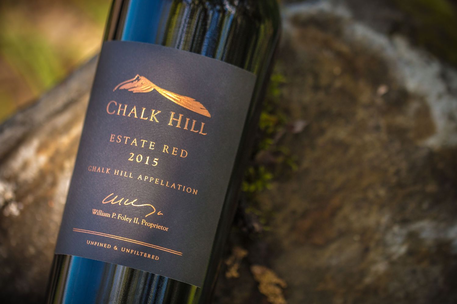 Close-up shot of Chalk Hill Estate Red wine bottle label against natural background.