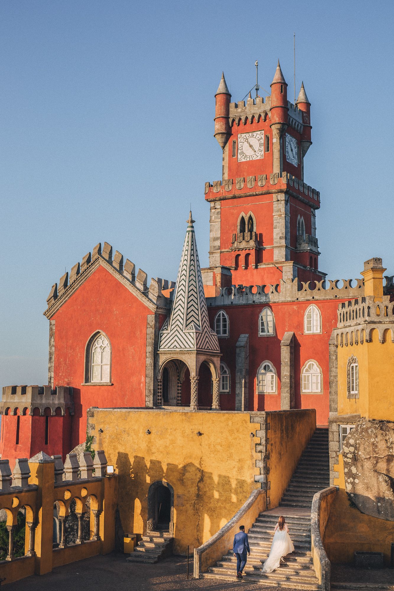 A dreamy photograph of bride and groom from a destination elopement at Pena Palace. captured by a Portugal wedding photographer