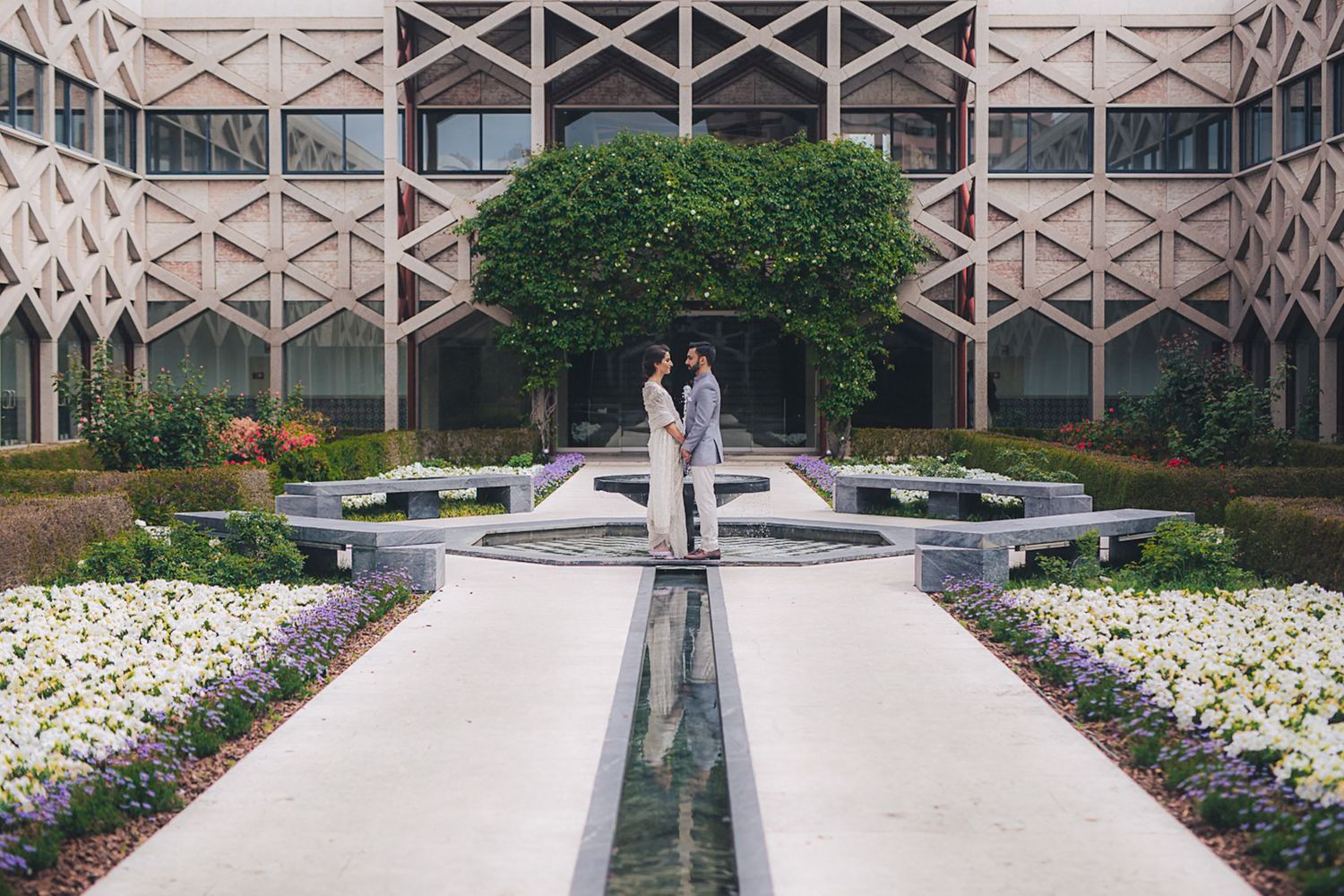 A Muslim couple sharing a romantic moment, photographed by an Indian destination wedding photographer in Portugal - Ismaili Lisbon Center
