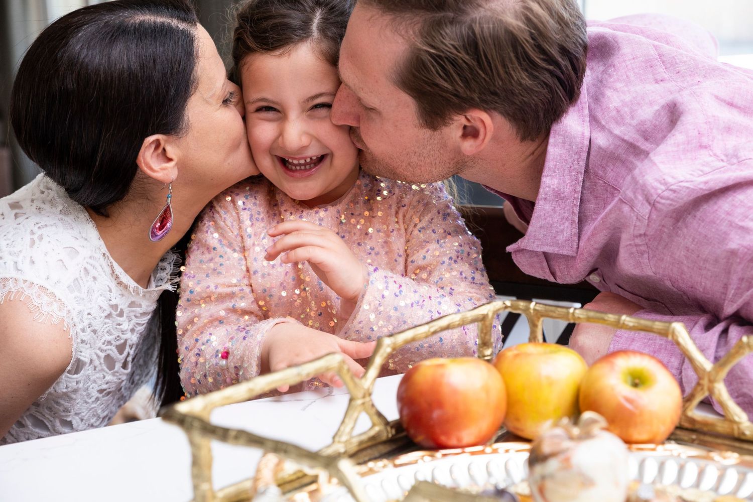 Tender family moment sharing sweets and snacks together at a cozy indoor setting. Family portraits, Rancho Cucamonga, San Bernardino photog
