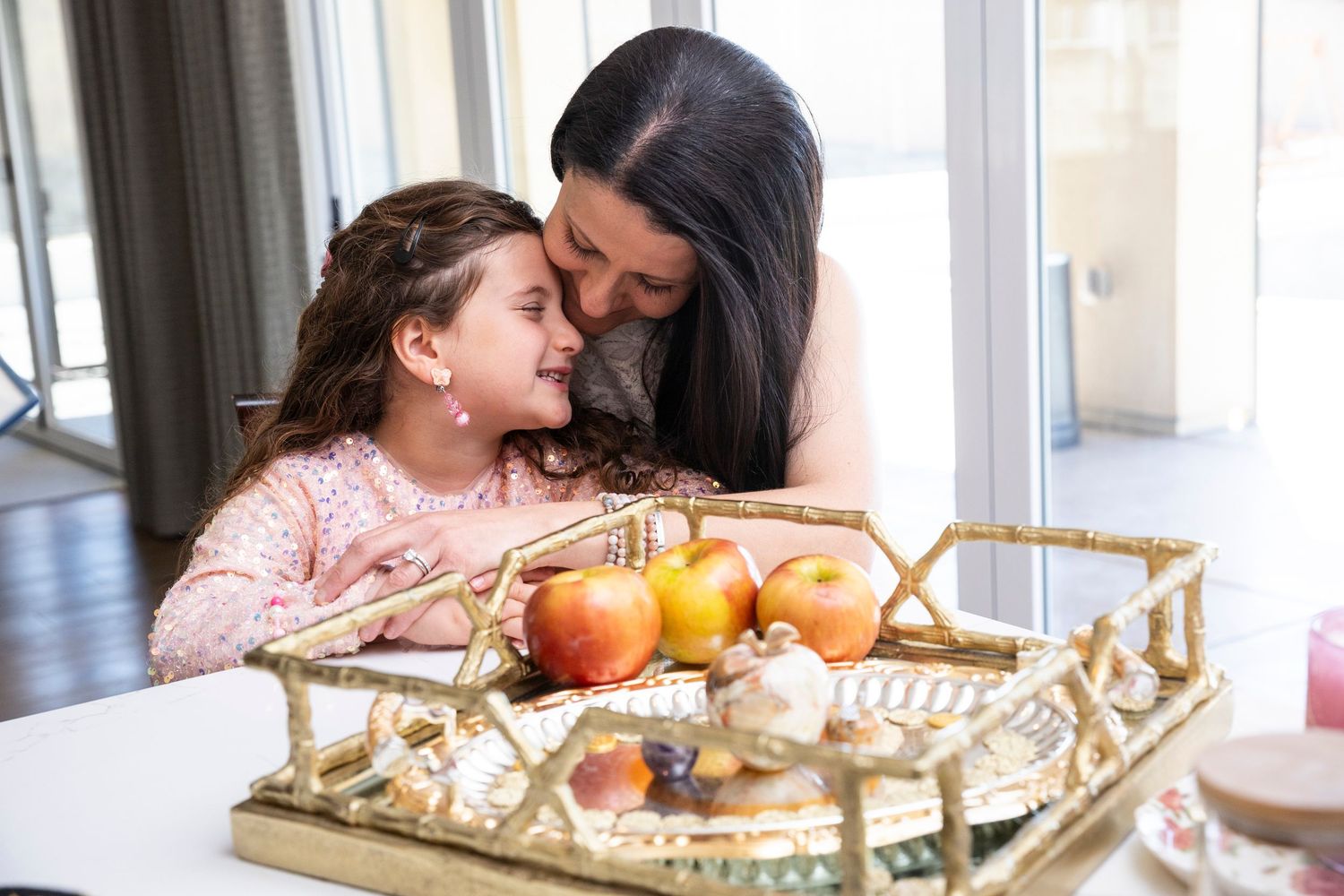 Intimate family gathering with fresh fruit displayed on an elegant gold serving tray. Mother and Daughter portrait. Rancho Cucamonga