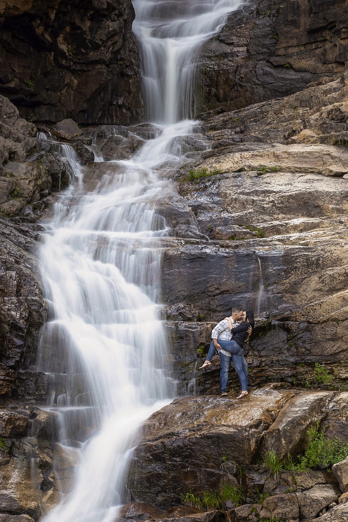 A sequence of cascading waterfall photographs showing progressive views of rushing water flowing down steep rocky cliffs.