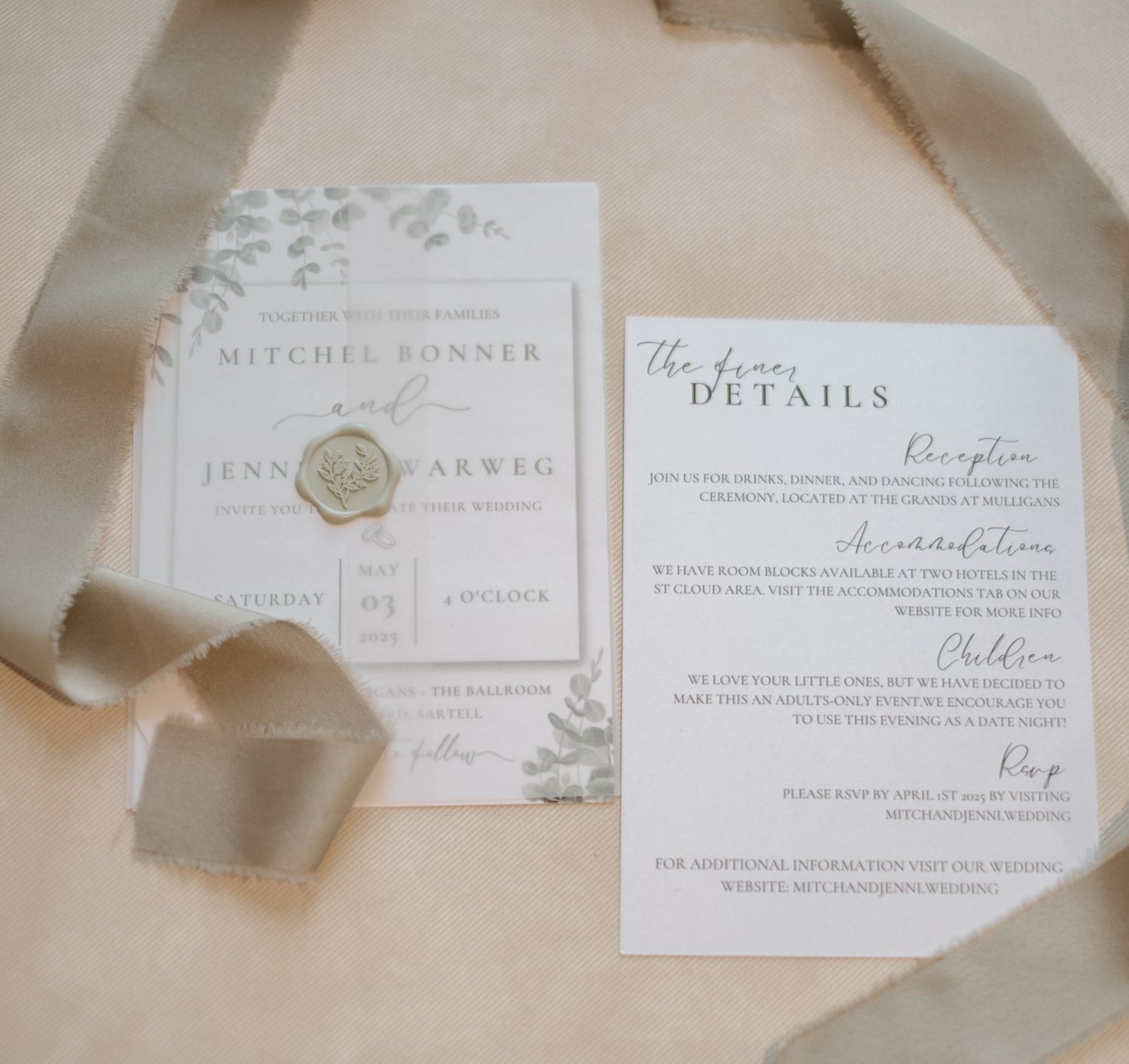 Elegant wedding invitation suite with delicate floral details and wax seal on cream paper.
