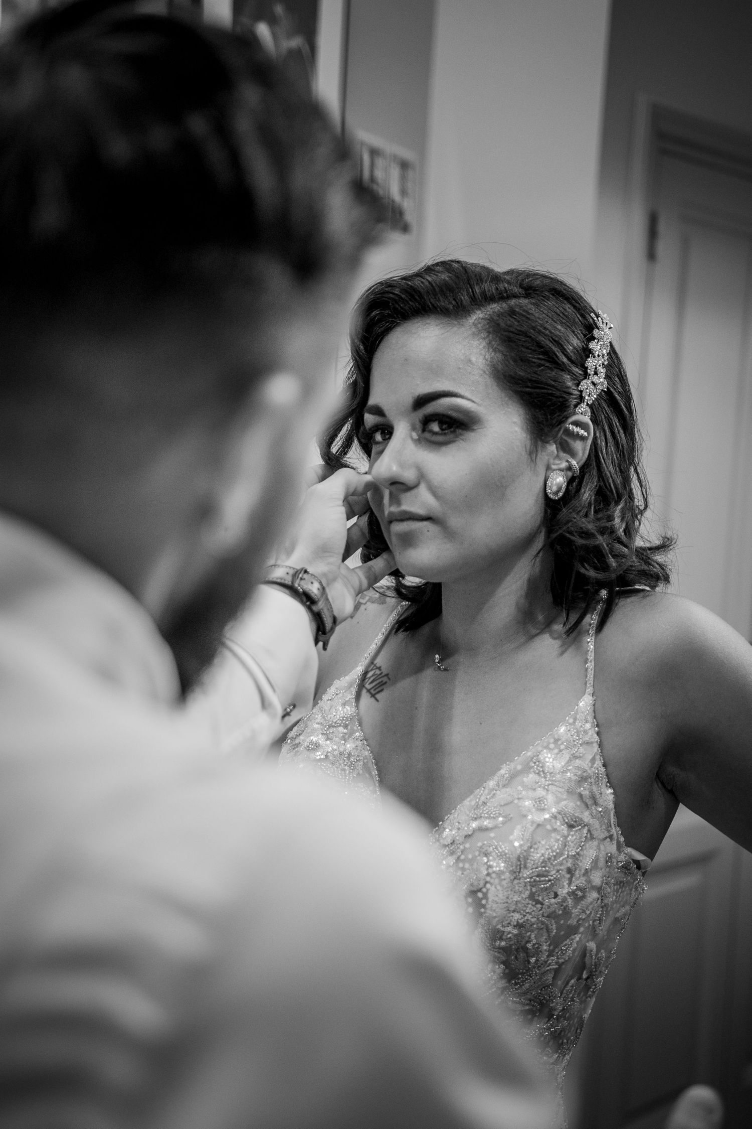 Black and white close-up series of wedding preparation moments.