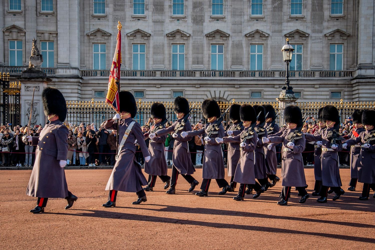 Guards march in formation during the Changing of the Guard ceremony at Buckingham Palace in London.