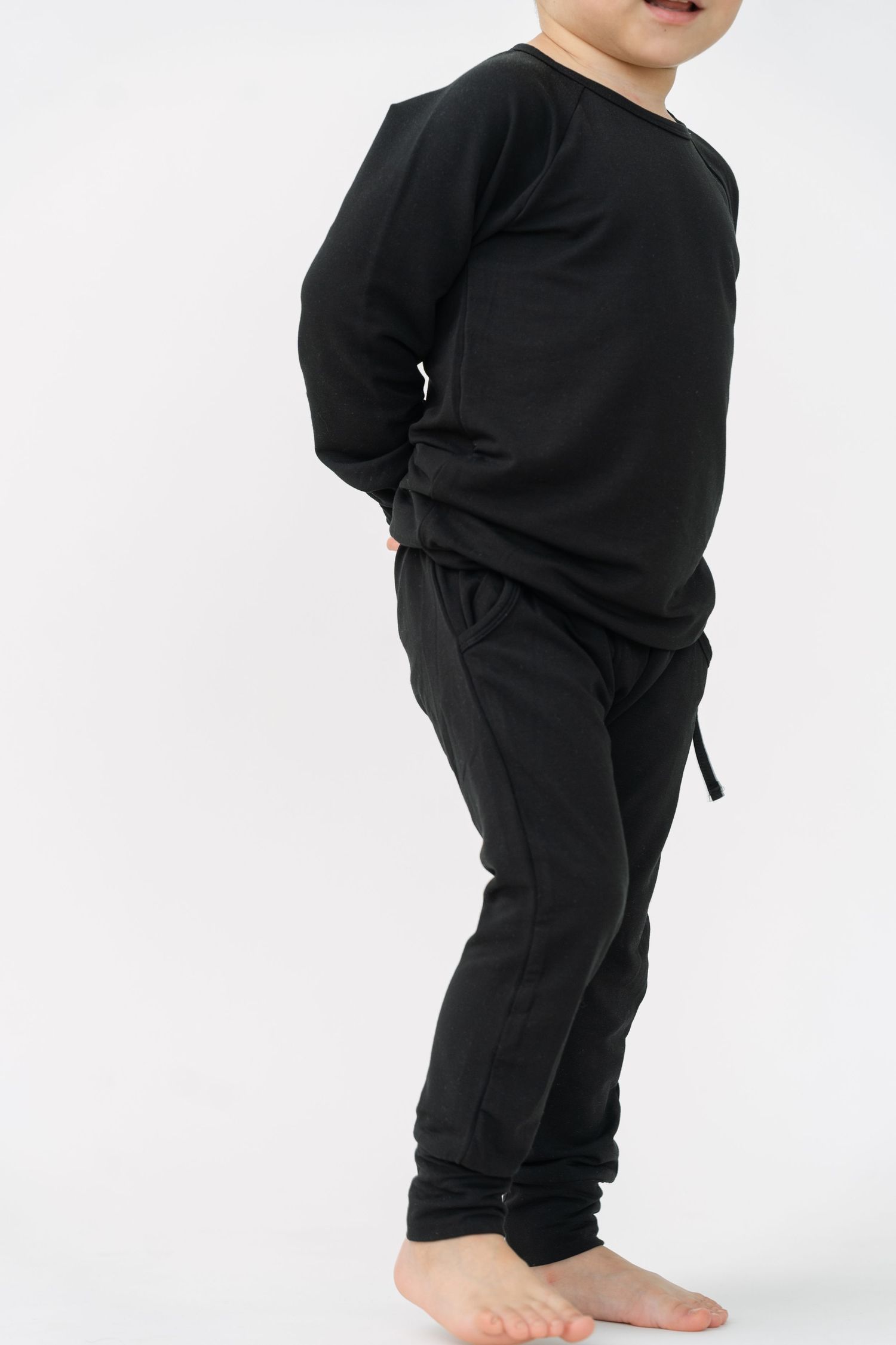 All-black loungewear set displayed against white background.
