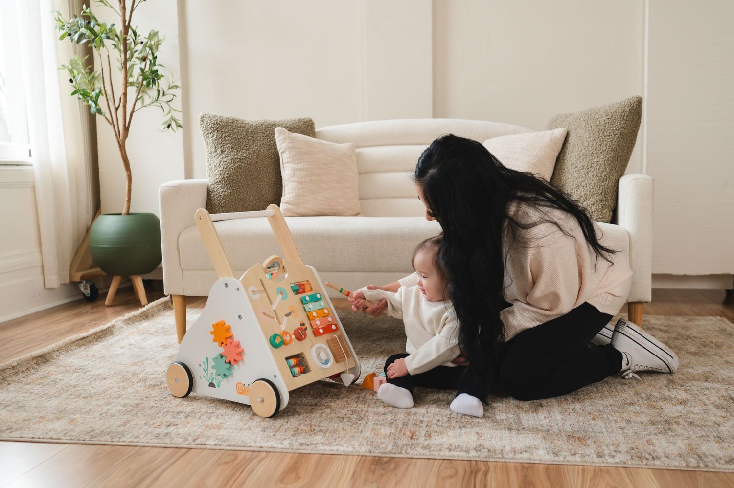 Parent and child spending quality time reading together with educational toys on a cozy living room floor.