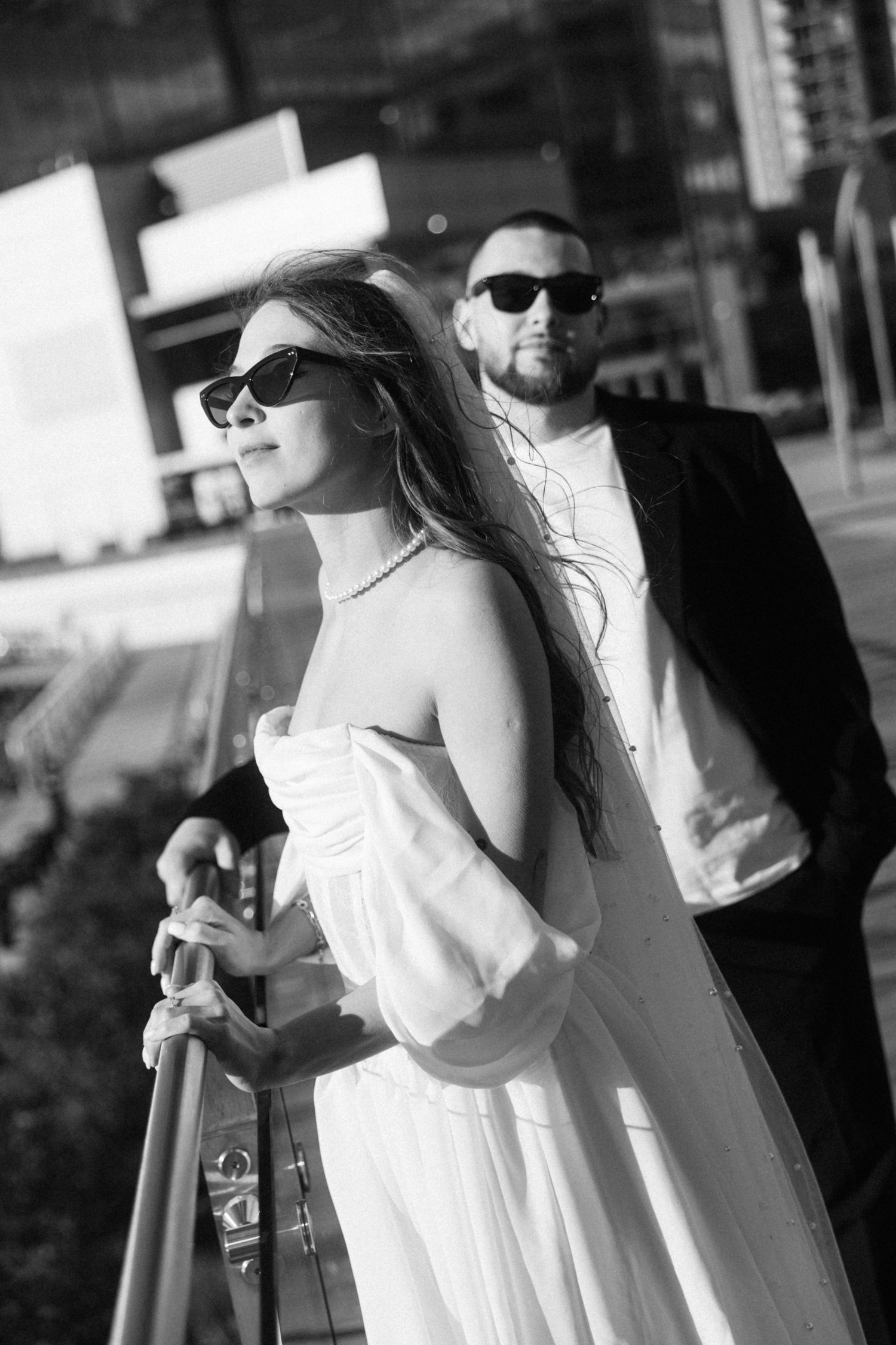 Outdoor photography sequence showing couple in formal wear with sunlight and dramatic shadows.