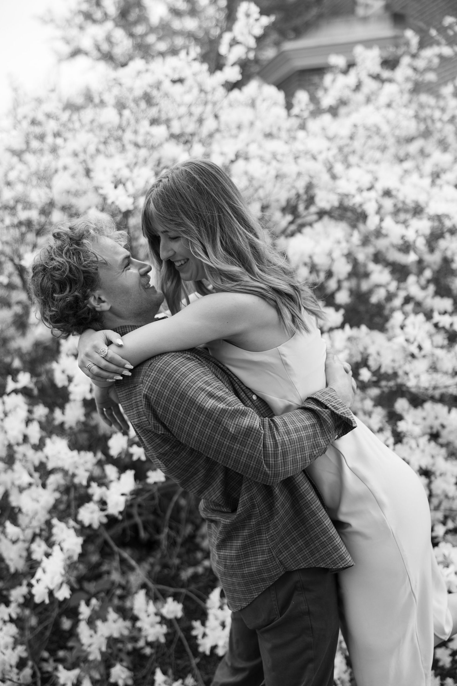 A romantic black and white photo series with blooming flowers in the background.
