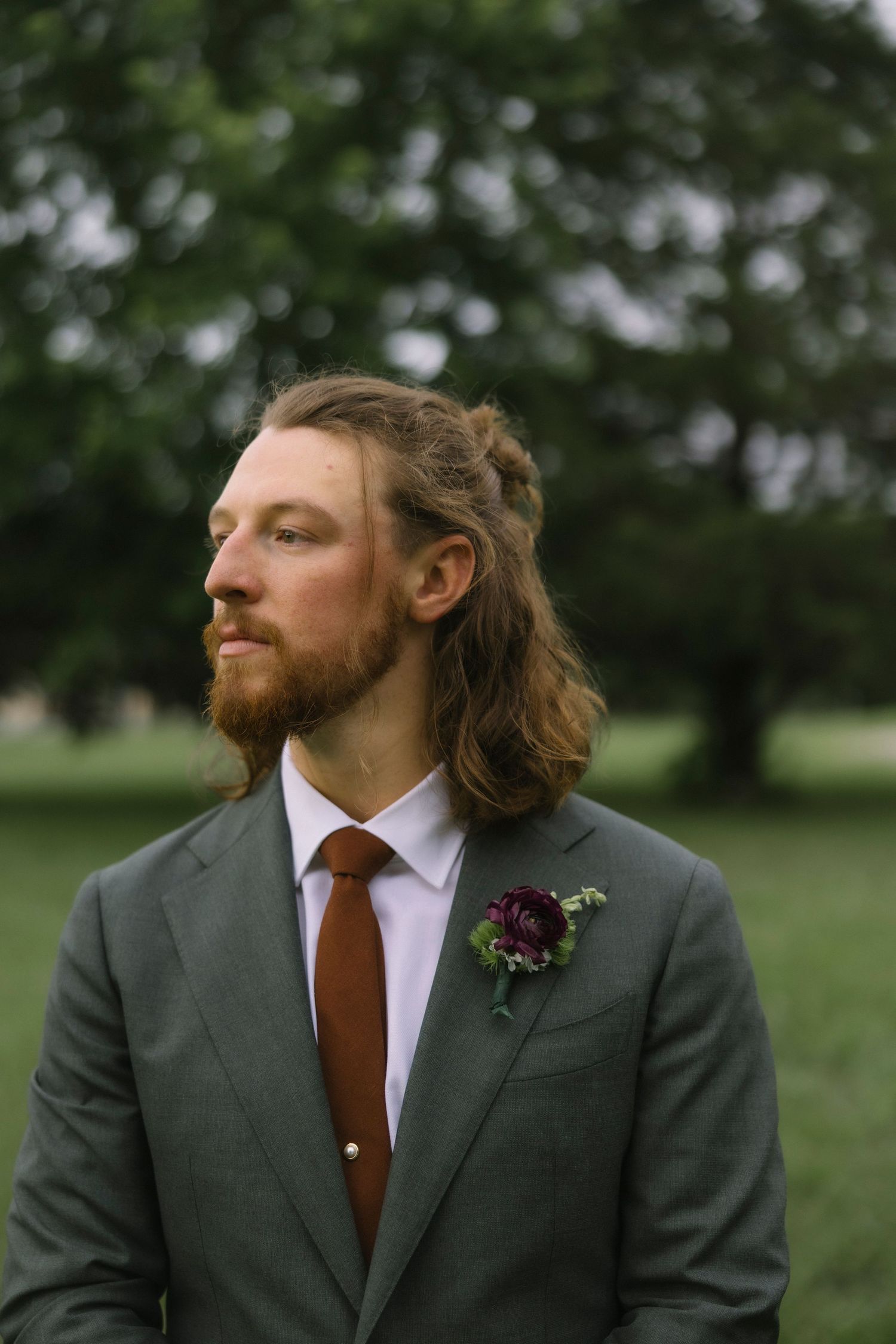 Wedding portrait sequence showing groom in grey suit and burgundy tie looking sideways.