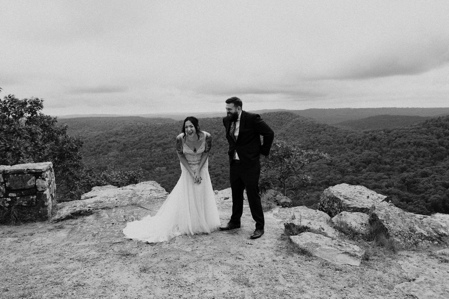 Scenic engagement photos were captured at sunrise over a wide rocky vista overlooking expansive mountain views.