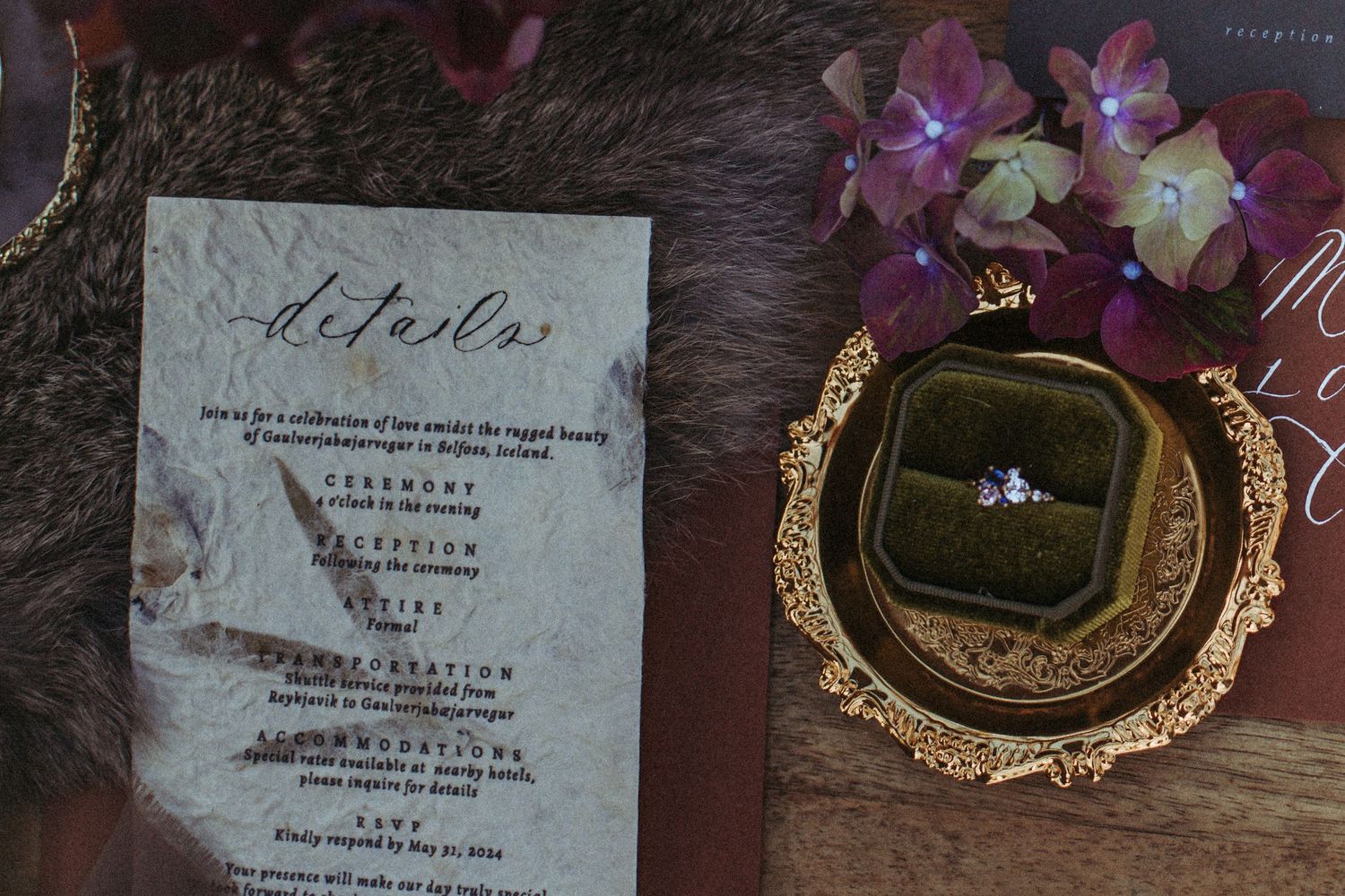 A collection of vintage oval picture frames and antique paper documents arranged in an artistic layout against a dark surface.