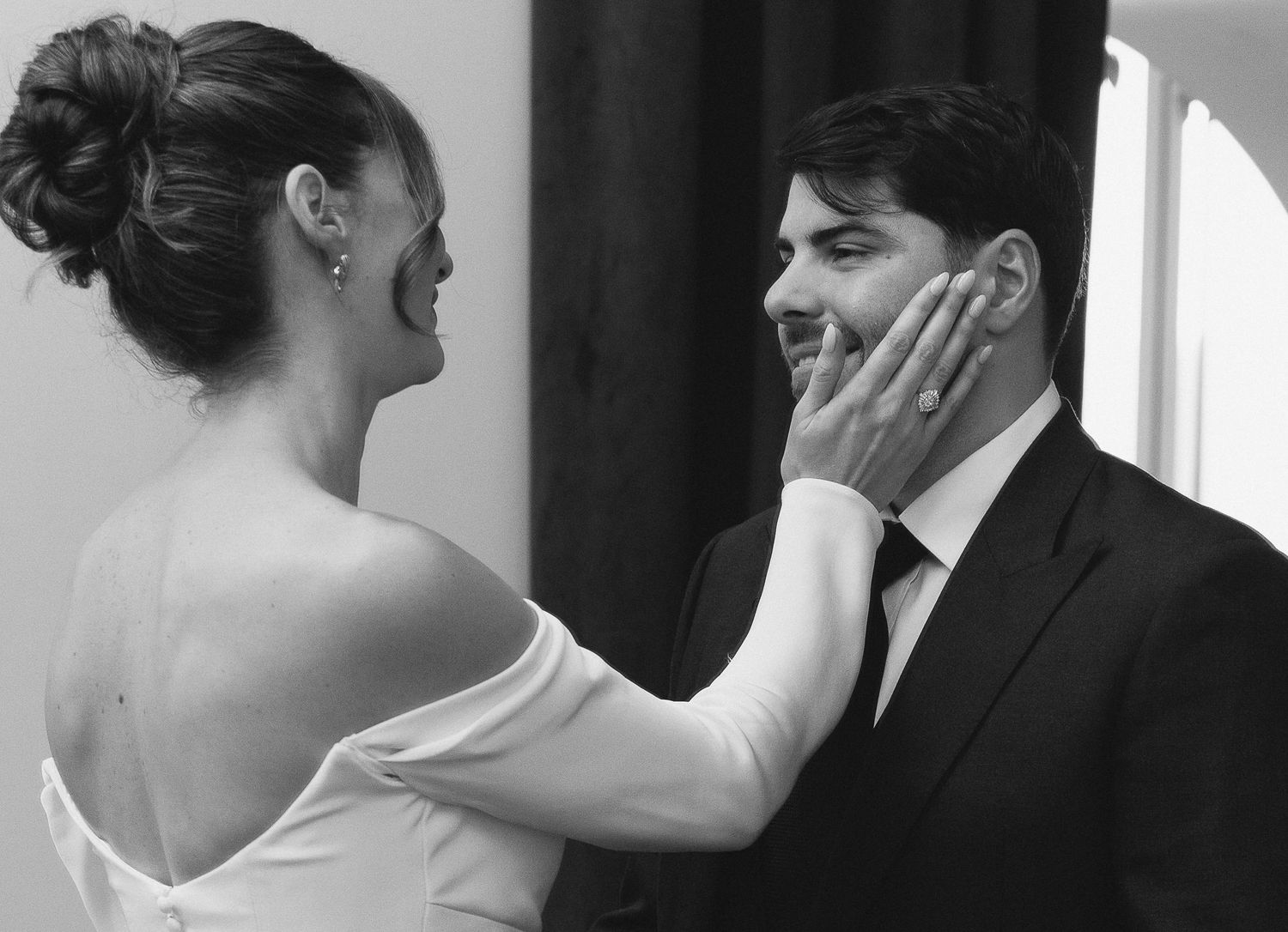 A series of five black and white wedding photographs showing intimate romantic moments and poses between a couple.