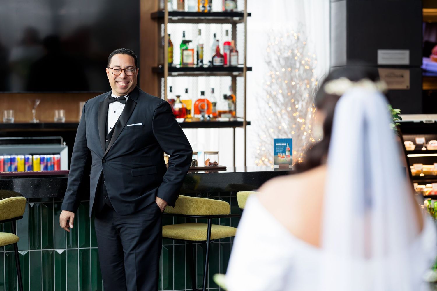 First look moment captured at a modern bar venue.