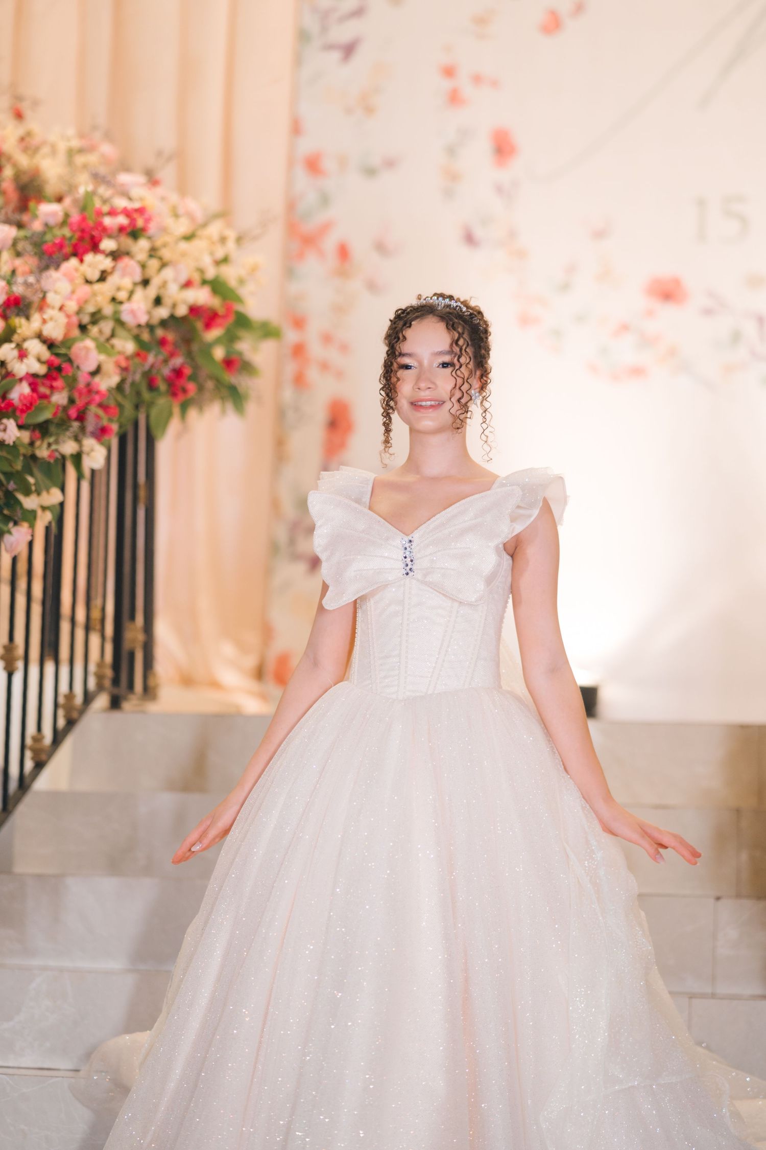 Classic ball gown wedding dress with sweetheart neckline set against romantic floral backdrop.