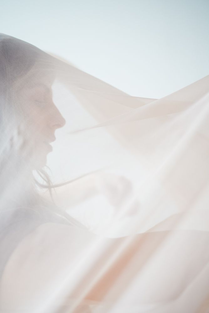 Ethereal white and peach colored abstract photographs with soft light and gentle flowing curves creating a dreamy effect.