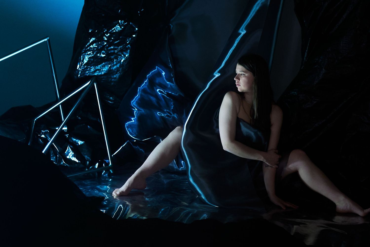 Artistic series of dance silhouettes in blue dramatic lighting with expressive movement and shadows.