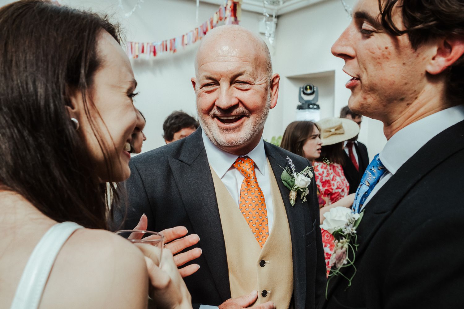 Intimate wedding moments captured during reception conversations.