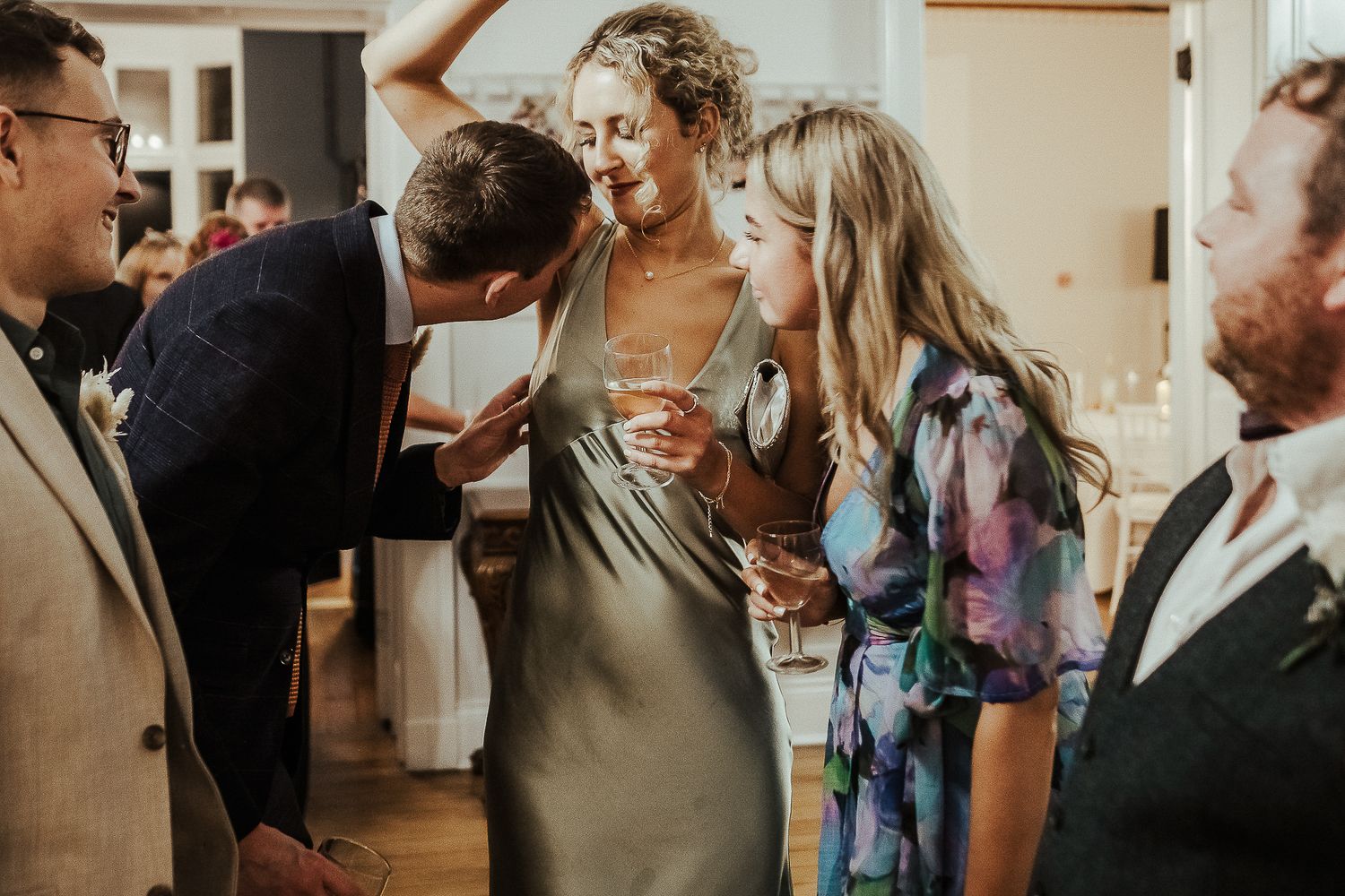 Guests mingling and socializing during a wedding reception.