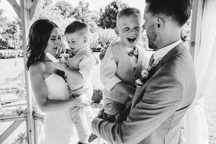 Black and white candid moments captured during a wedding celebration.